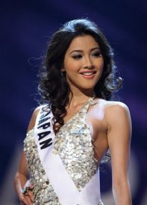 Miss Japan Emiri Miyasaka poses on the runway in the evening gown segment of the 2009 Miss Universe Preliminary Competition, at Atlantis, Paradise Island, Bahamas, Sunday, Aug. 16, 2009. During the Aug. 23 final pageant, Miss Universe will be picked from among contestants from 84 countries. (AP Photo/Tim Aylen)